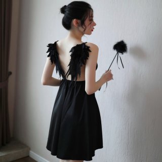 A woman models a black suoqing sensual lingerie set, featuring a strapless design with feathered wings on the back, perfect f...