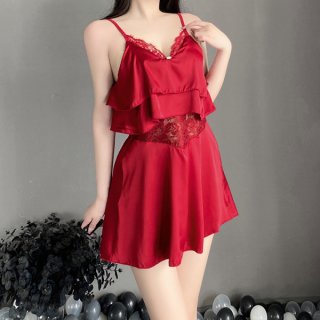 Woman wearing red sheer chiffon lingerie set with ruffled cami top and adjustable straps, paired with matching shorts.
