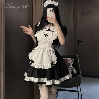 A woman poses in a black and white maid costume with ruffles, perfect for anime cosplay or role play. the outfit features a c...