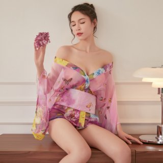A woman elegantly poses wearing a sheer chiffon japanese kimono lingerie set adorned with vibrant butterfly prints, perfect f...