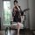 A woman poses elegantly in a black floral kimono-themed erotic lingerie set, holding a decorative fan. the outfit features in...