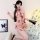 Woman modeling sheer red butterfly-embroidered cheongsam lingerie set with vintage pure-temptation design, holding fan.