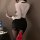 Woman in sheer secretary costume with tight skirt, holding laptop; includes leopard print stockings and red heels for role pl...