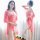 Woman modeling pink lace camisole sleep dress with sheer robe, elegant and tempting lingerie set for bedroom.