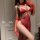 Woman wearing a seductive red lingerie set with sheer gloves and a rose choker, embodying the naughty step-mom style.