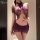 Woman wearing yaqin sexy lingerie set - purple lace bodycon skirt with sheer top, plus size intimate outfit for couples.