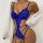 Woman wearing royal blue lace bodysuit with sheer panels, paired with white cardigan; elegant erotic lingerie set for nightwe...