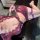 Woman wearing purple lace nursing lingerie set with sheer bra, panties, and garter straps in seductive pure-yu style.