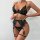 Sexy black lace lingerie set with gold accents, featuring a seductive bodysuit and thong for women.