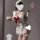 Sexy maid costume for women featuring a white ruffled dress with a red bow, perfect for sleepwear or themed outfits.