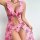 Pink floral sheer lace low-back slip dress with ruffled neckline and thigh-high cutouts, perfect for women seeking elegant an...