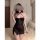 A woman models a black sheer mesh lace bralette set with underwire and push-up pads, featuring a halter neck design and lace ...