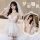Woman in white lace mesh sheer deep v bodysuit with veil and gloves, styled as bridal lingerie set.