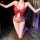 Woman kneeling in red butterfly lingerie set with tie-dye bodice, sheer straps, and matching thong. night silk sexy lingerie ...