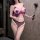 Woman wearing purple pure temptation cat costume lingerie set with sheer mesh, cut-out chest detail, and fishnet stockings.