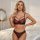 Woman modeling luxury lace sheer bra set with floral embroidery and transparent mesh, plus size sexy lingerie.