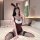 Woman wearing plus size bunny costume bodysuit with ears, sitting on bed in sexy tight-fitting role play outfit for adults.