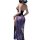 Woman wearing a seductive lace lingerie set with a sheer blue skirt and black bodice, featuring elegant straps and a modest y...