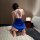 Woman wearing blue feiniao moon gazing sexy qipao sleep dress with deep v back and asymmetrical hem, kneeling on fluffy rug b...
