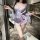 Woman wearing qqny pure allure sleepwear set, elegant lavender lingerie with floral print and flowing sleeves in modern kitch...