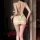 Woman wearing nightsi sheer mesh lace camisole sleep dress with deep v-back and delicate straps, holding wine glass in dimly ...