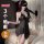 Woman wearing black lace qqny pure allure sleepwear set with blindfold and rose, holding feather duster in luxurious bedroom ...