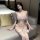 Woman modeling white ailenni lace lingerie set with bra, panty, and matching robe in bedroom setting.