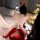 A woman poses with a smartphone, wearing a red-themed christmas outfit from dolllove lingerie set - passionate red 3-piece bi...