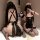 Two women in black and pink maid costumes with lace trim, one holding a phone for a selfie, showcasing the pure & playful lin...