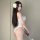 Woman wearing white lace open-crotch bodysuit with flower hair accessory, qqny-style seductive sleepwear for small busts.