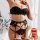 Sexy black lace lingerie set with gold chains, featuring a push-up bra and matching garter belt for women.