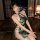 Sexy off-shoulder split cheongsam outfit with pearl accents, modern design inspired by traditional qipao, perfect for evening...