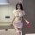 Woman wearing sockle 410 sexy nurse costume set – pink lacy role play outfit with sheer mesh, red cross accents, and matching...