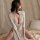 Sexy lace lingerie dress featuring a deep v-neckline and side slits, perfect for sultry bodycon sleepwear or costume outfits.