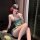 A woman poses elegantly in a sensual, green exotic bralette set with floral embroidery, perfect for intimate moments. the min...