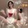 Woman wearing white lace maid costume with red bow, holding teacup; back view shows open design. plus size sexy lingerie slee...