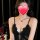 A woman wearing a black sheer mesh bralette sleep dress featuring lace trim and side slit, paired with a delicate necklace.