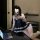 A woman poses seductively with a laptop, wearing a black and white lace lingerie set from pure & playful. the design features...