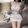 Woman in white lace lingerie set with teddy bear on couch – romantic french palace style vintage sleepwear.