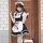 A stylish model poses wearing a black and white maid costume, complete with a cat paw design on the apron, perfect for cospla...