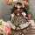 A charming bjd doll dressed in a vintage princess outfit, featuring a floral dress with lace details and a matching bonnet, p...