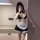 Woman modeling suoqing maid costume set: black & white 6-piece lingerie outfit with ruffles, apron, choker, and garters.