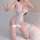 A woman poses wearing a sheer lace bodysuit with push-up effect, featuring an open-crotch design inspired by swimwear and sle...