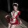 A woman poses in a maid cosplay outfit featuring a red and white dress with ruffles, lace details, and a bow tie. the ensembl...