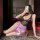 A woman poses seductively wearing a yese yese sexy lace bodycon dress, featuring intricate lace details and a silky pink skir...