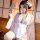 A woman wears a japanese kawaii bunny kimono robe, featuring lace details, bows, and floral prints, perfect for private wear.