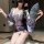 A woman poses elegantly in a japanese kimono lingerie set, featuring floral patterns and a flowing design, perfect for role p...