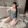 Woman wearing yaseyese japanese-inspired lingerie set with floral kimono-style top, lace-trimmed shorts, and white thigh-high...