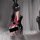 Woman in red and black christmas bunny girl costume with lace bodysuit, bunny ears, and thigh-high stockings.
