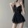 Woman wearing black lace sleepwear dress with sheer details and flirty design, perfect for seductive bedroom lingerie.